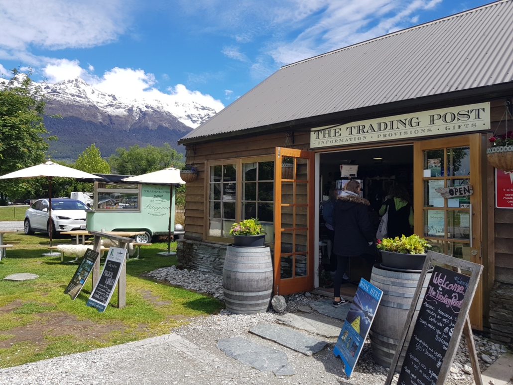 Outside of Trading Post shop with gardens and mountains