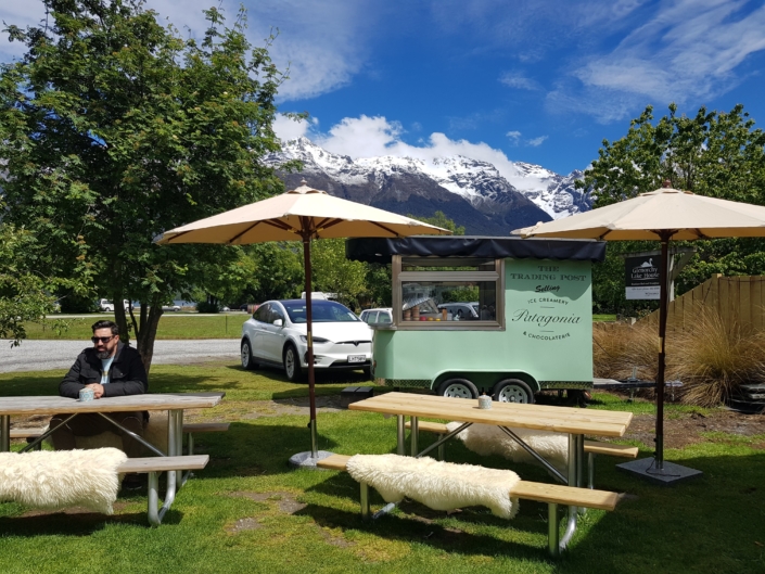 Patagonia ice cream truck in Trading Post garden at Glenorchy with picnic benches