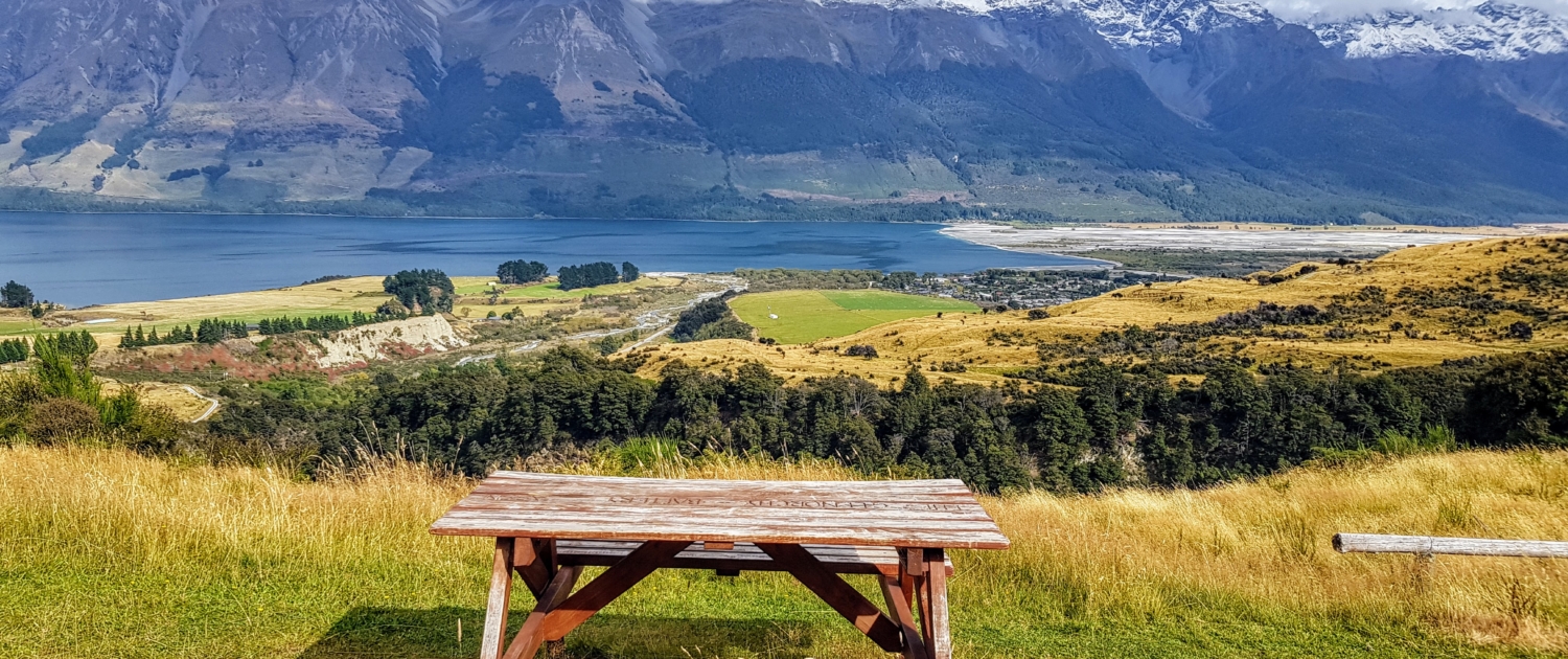 Picnic bench with view of Glenorchy, lake and mountains