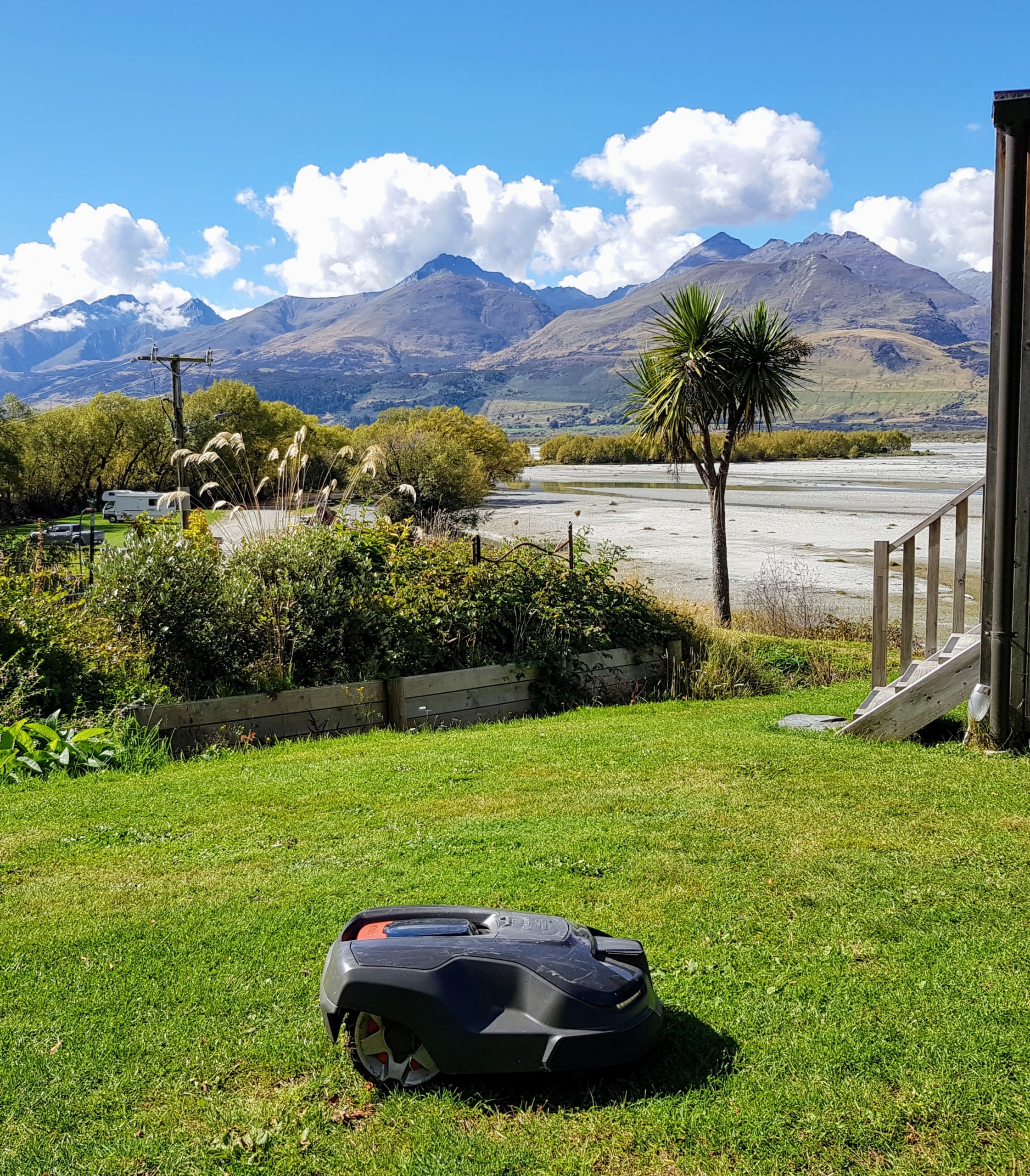 Robot lawn mower at EcoScapes with Glenorchy mountains